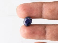 Natural Kaka Neeli Stone Iolite 4.31 carat in hand size reference