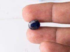 Natural Kaka Neeli Stone Iolite 4.36 carat in hand size reference