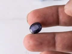 Natural Kaka Neeli Stone Iolite 4.41 carat in hand size reference
