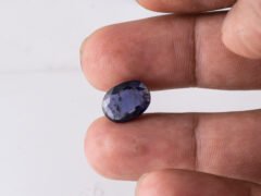 Natural Kaka Neeli Stone Iolite 4.53 carat in hand size reference