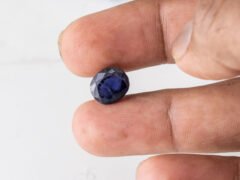 Natural Kaka Neeli Stone Iolite 4.76 carat in hand size reference