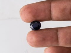 Natural Kaka Neeli Stone Iolite 5.17 carat in hand size reference