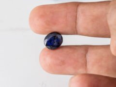 Natural Kaka Neeli Stone Iolite 5.29 carat in hand size reference