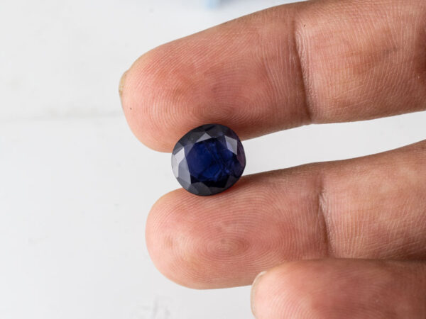 Natural Kaka Neeli Stone Iolite 5.56 carat in hand size reference