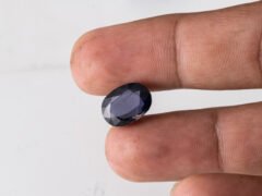 Natural Kaka Neeli Stone Iolite 5.57 carat in hand size reference