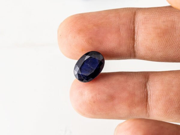 Natural Kaka Neeli Stone Iolite 5.62 carat in hand size reference