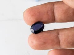 Natural Kaka Neeli Stone Iolite 5.78 carat in hand size reference