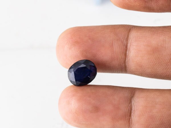 Natural Kaka Neeli Stone Iolite 5.86 carat in hand size reference