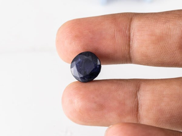 Natural Kaka Neeli Stone Iolite 5.86 carat in hand size reference