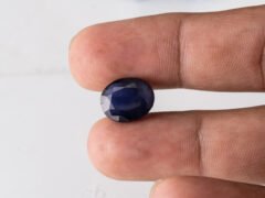 Natural Kaka Neeli Stone Iolite 6.20 carat in hand size reference
