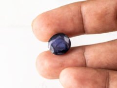 Natural Kaka Neeli Stone Iolite 6.21 carat in hand size reference