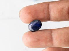 Natural Kaka Neeli Stone Iolite 6.41 carat in hand size reference