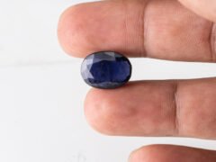 Natural Kaka Neeli Stone Iolite 7.13 carat in hand size reference