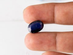 Natural Kaka Neeli Stone Iolite 7.34 carat in hand size reference