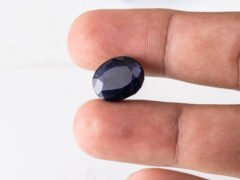 Natural Kaka Neeli Stone Iolite 7.66 carat in hand size reference