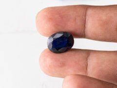 Natural Kaka Neeli Stone Iolite 7.70 carat in hand size reference