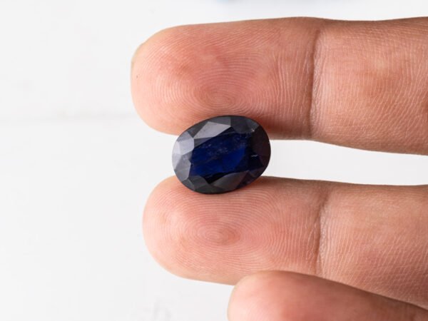 Natural Kaka Neeli Stone Iolite 7.70 carat in hand size reference