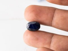 Natural Kaka Neeli Stone Iolite 7.71 carat in hand size reference