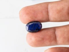 Natural Kaka Neeli Stone Iolite 8.01 carat in hand size reference