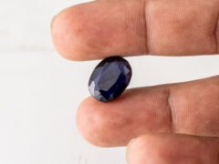 Natural Kaka Neeli Stone Iolite 8.38 carat in hand size reference