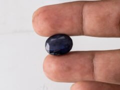 Natural Kaka Neeli Stone Iolite 8.65 carat in hand size reference