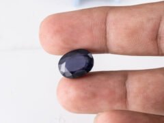 Natural Kaka Neeli Stone Iolite 9.03 carat in hand size reference