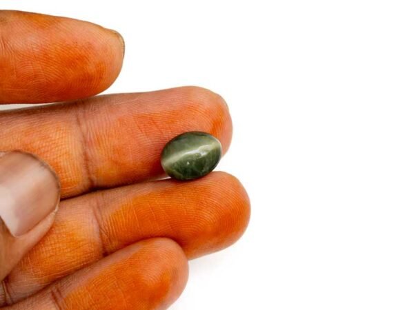 Quartz Cats Eye Lahsuniya 5.19 Carat in-hand view gray cabochon