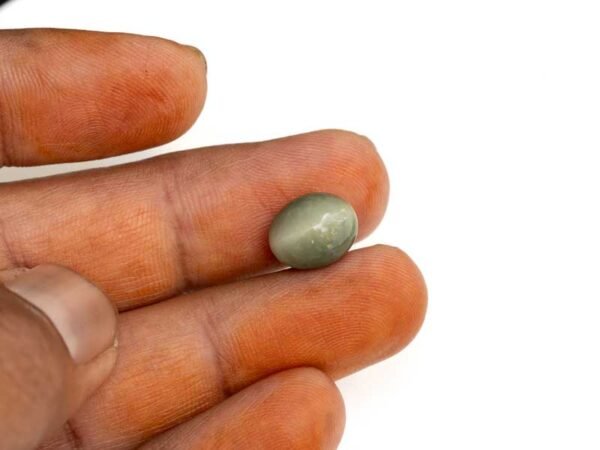 Quartz Cats Eye Lahsuniya 5.48 Carat in-hand view gray cabochon