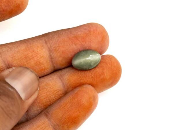 Quartz Cats Eye Lahsuniya 5.63 Carat in-hand view gray cabochon