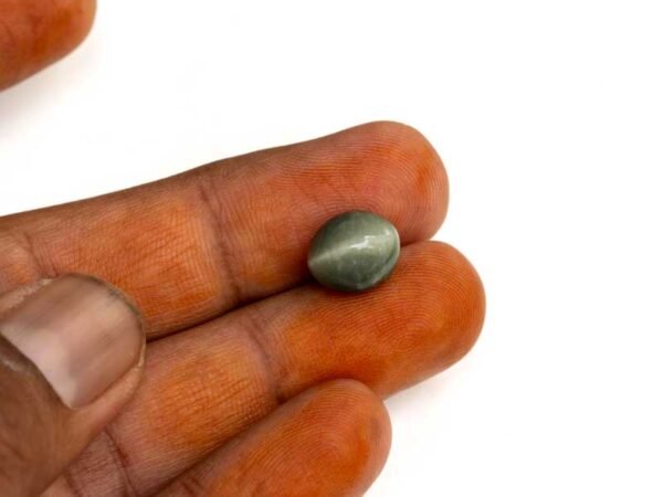 Quartz Cats Eye Lahsuniya 6.20 Carat in-hand view gray cabochon