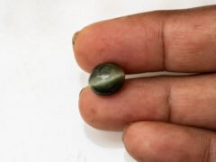 Quartz Cat's Eye Lahsuniya 6.32 carat in-hand actual size