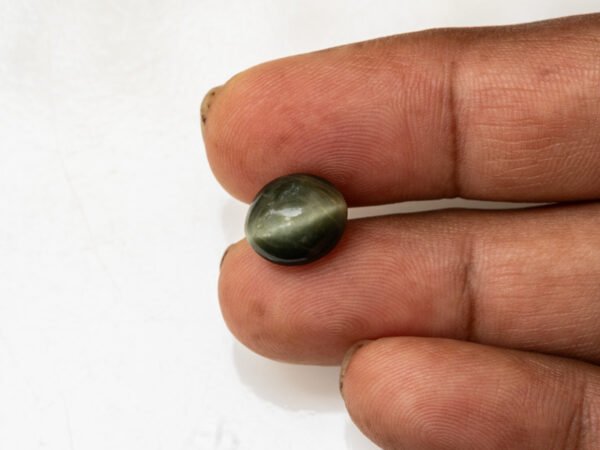 Quartz Cat's Eye Lahsuniya 6.32 carat in-hand actual size