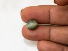 Quartz Cat's Eye Lahsuniya 6.44 carat in-hand actual size