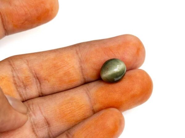Quartz Cats Eye Lahsuniya 7.08 Carat in-hand view gray cabochon