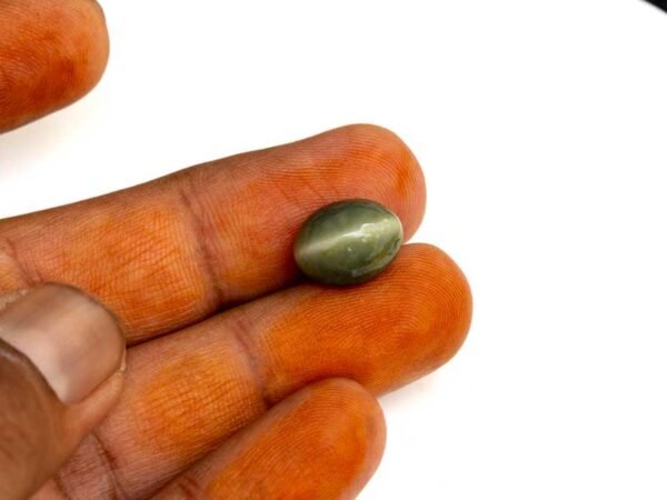Quartz Cats Eye Lahsuniya 7.39 Carat in-hand view gray cabochon