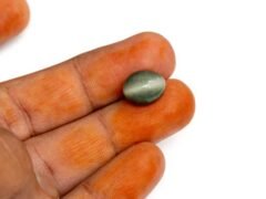 Quartz Cats Eye Lahsuniya 7.80 Carat in-hand view gray cabochon