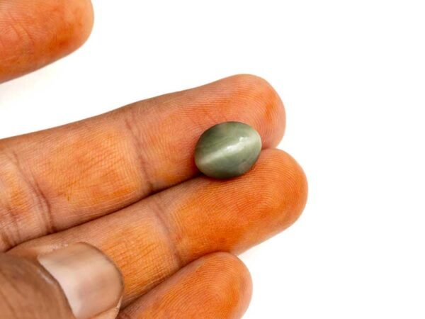Quartz Cats Eye Lahsuniya 8.14 Carat in-hand view gray cabochon
