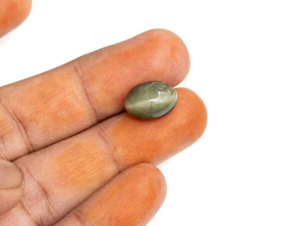 Quartz Cats Eye Lahsuniya 8.20 Carat in-hand view gray cabochon
