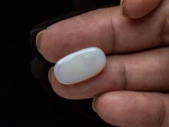 Australian Fire Opal Stone 6.46 carat in hand view