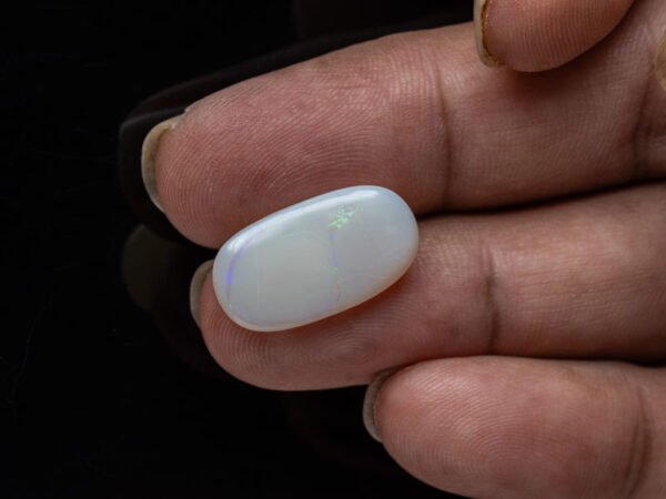 Australian Fire Opal Stone 6.46 carat in hand view