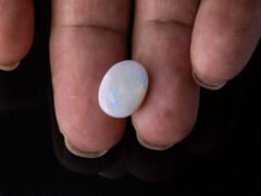 Australian Fire Opal Stone 3.42 carat in hand view