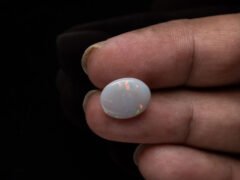 Australian Fire Opal Stone 3.27 carat in hand view