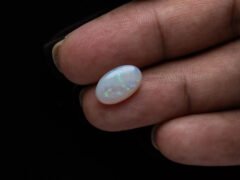 Australian Fire Opal Stone 2.59 carat in hand view