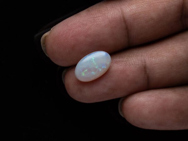 Australian Fire Opal Stone 2.59 carat in hand view