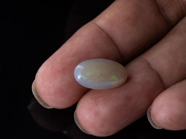 Australian Fire Opal Stone 6.88 carat in hand view