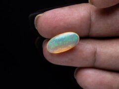 Australian Fire Opal Stone 6.83 carat in hand view