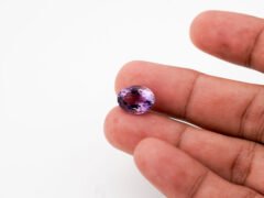 Natural Jamunia Stone Amethyst 6.12 carat in hand size reference