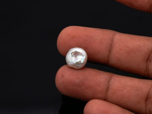 Keshi Pearl Moti 5.25 carat in hand actual size reference