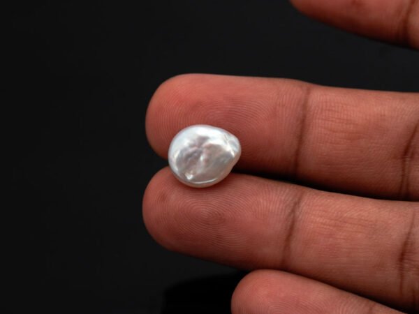 Keshi Pearl Moti 5.92 carat in hand actual size reference