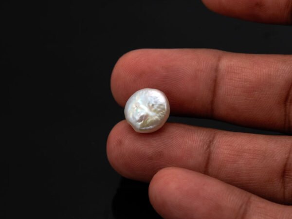 Keshi Pearl Moti 5.94 carat in hand actual size reference